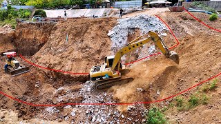 Hard Project! Excavator operator is making road for dump truck unloading rock soils to deep bottom