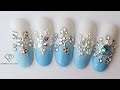 Winter nails. Crystals placement snowflakes nail art with gel ombre. Nail art trends