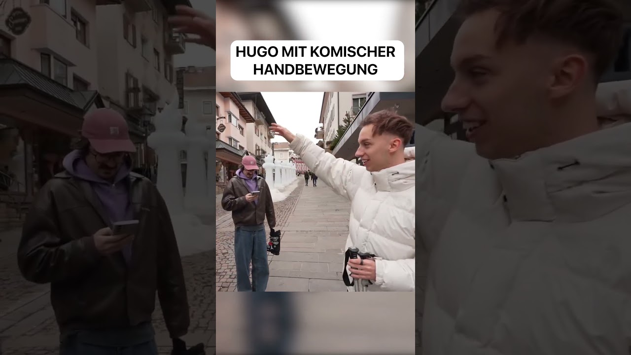 Hugo mit komischer Handbewegung...
