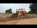 Excellent work of cat d6r  bulldozer operator leveling the ground for coastal road construction