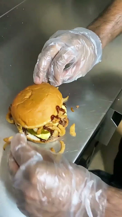 Here is how our ingenious BBQ Haystack Cheeseburger comes to life!    #burgeria #biggerbetterburger