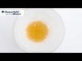 Mixing of shampoo with aromatic oil and gold powder