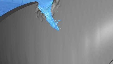 Breaching of the top of concrete dam due to blast load