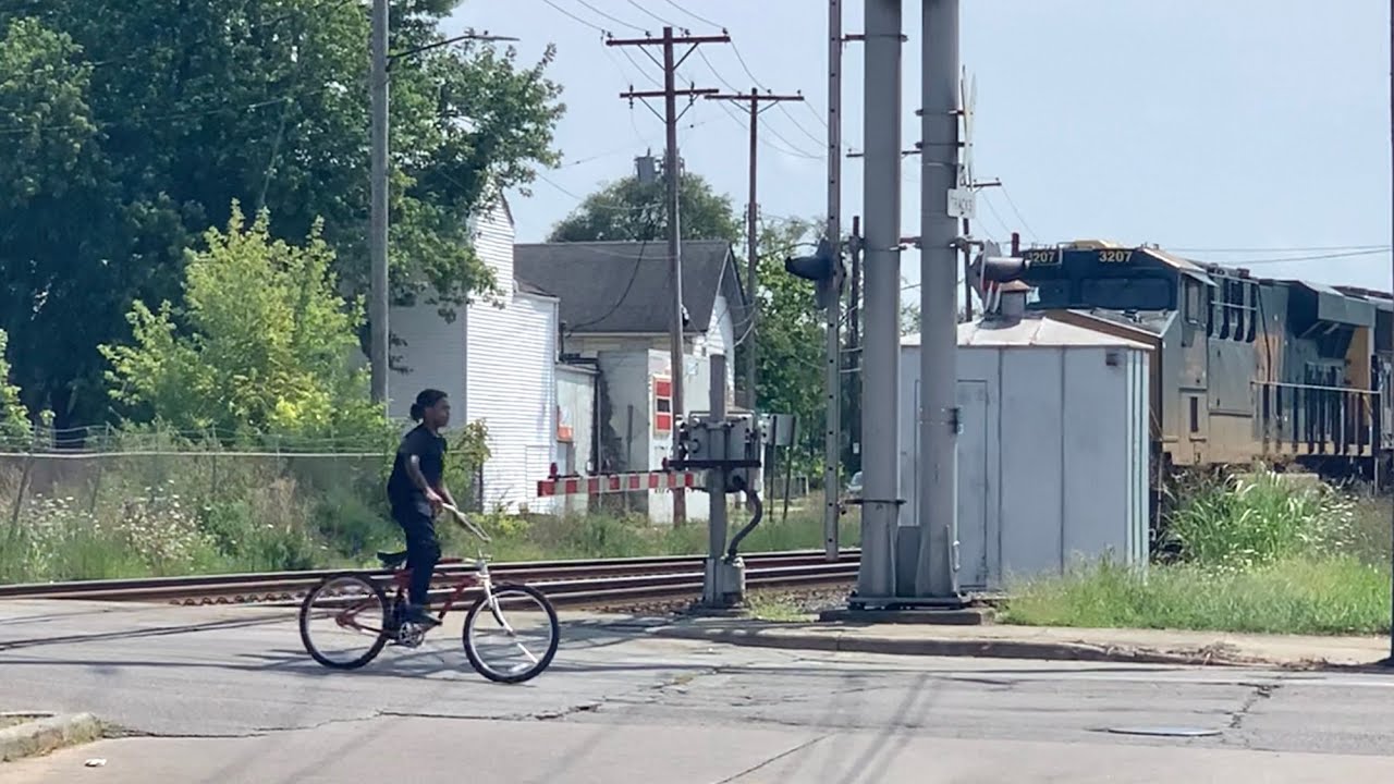Guy Rides Bike In Front Of Train, Is That A Caboose On That Train? 5 Locomotives Railroad Switching