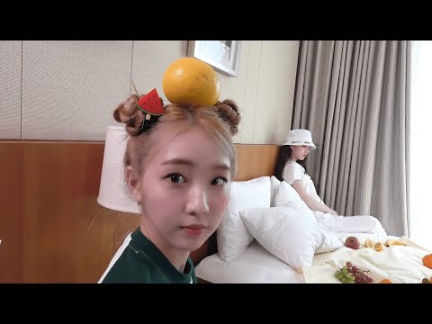 Yeojin smiling with an orange on her head