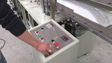 Automatic embossing and cutting tissue paper napkin folding machine