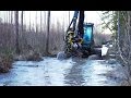 Timberjack 1270D harvester in winter forest