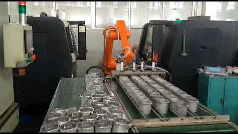 The 6 axis robot pick and place products form the CNC machine