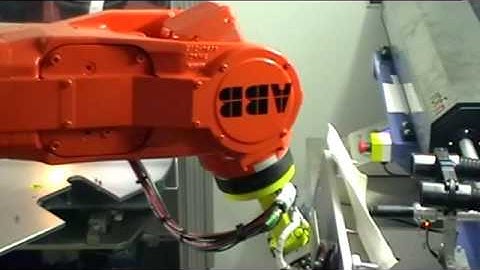 Laser cutting robot cell:   Automotive Trim