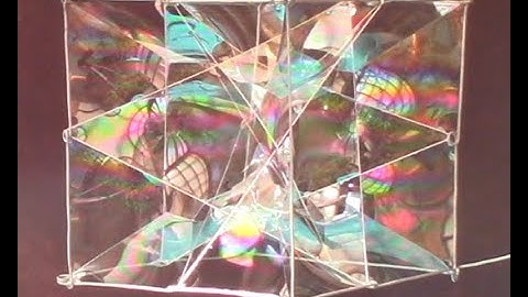 Kinetic Cube with 4 Inscribed Triangles and Minimal Surfaces