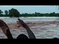 Of people trying to swim in flood water after their boat capsized between madogo  garissa