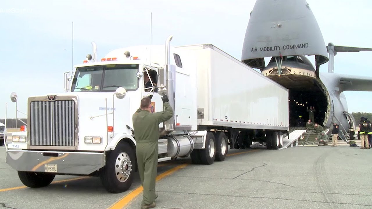 Watch A Gigantic C5 Galaxy Cargo Aircraft Swallows A Semi Truck YouTube