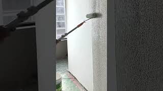 Creating texture on the wall surface using a long handled roller brush vertically #shorts
