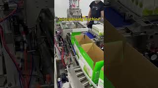 Juice packing machine# A machine that packs juice into cartons #packingmachine #casepacker