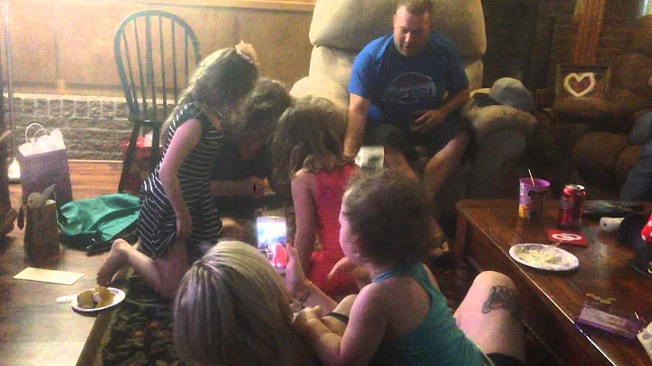 Lisa Cornett opening up a birthday present - conta...