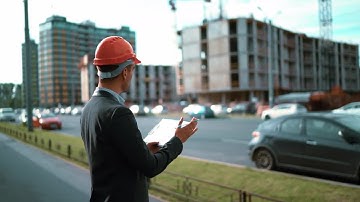Engineer with Paper Plan Of A Building Stock Video