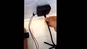 Gate1® Remote transmitter kit installed on a Liftmaster garage opener