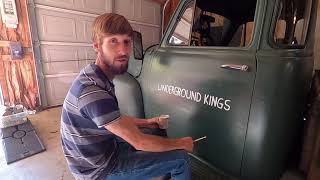Hand painting the logo on the 52!