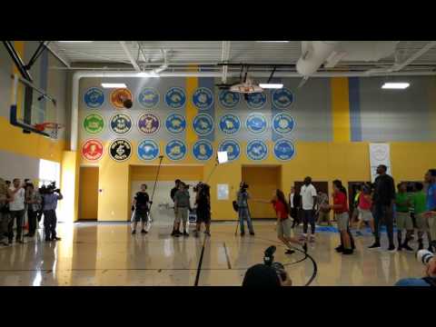 Kevin Durant playing basketball with the kids from IDEA charter school