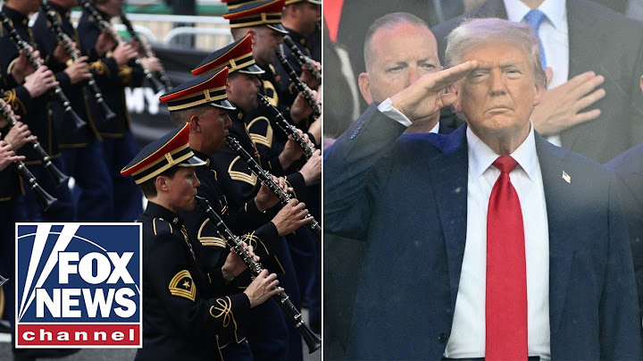 'Army Goes Rolling Along' as Trump salutes troops at military parade