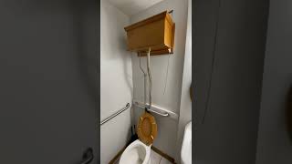 High Tank Pull Chain Toilet With Oak Raised High Tank In Action