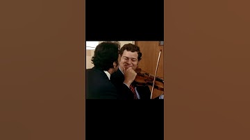 Two musicians, one violin: Stars having fun backstage