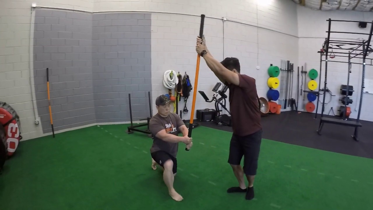 dynamic core exercise Core Strength And Stability Partner Drill - Stick Mobility Exercise