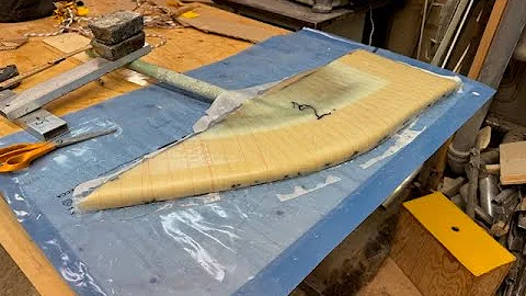 Laminating rudder, port side, laminating deck house, port side.