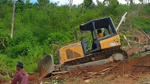 Bulldozer Operator CAT D5K XL Terraces on a High Hill