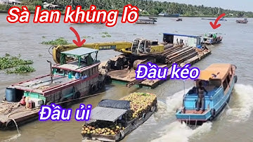 Sà lan khủng lồ đầu kéo đầu ủi ra cống quá vất vả