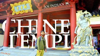 INDIAN VISITING CHINESE TEMPLE IN SINGAPORE CHINATOWN