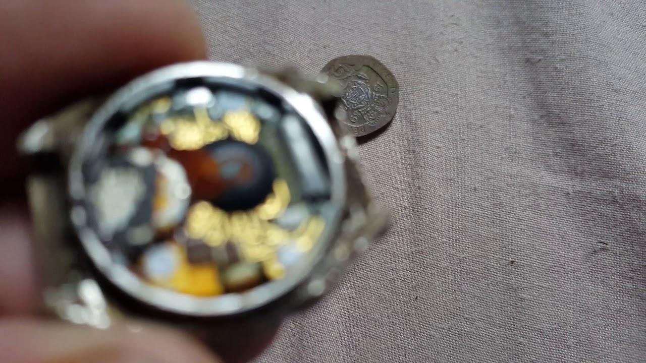 Reloj con Oro y monedas encontradas con el detector de metales. camera iphone 8 plus apk