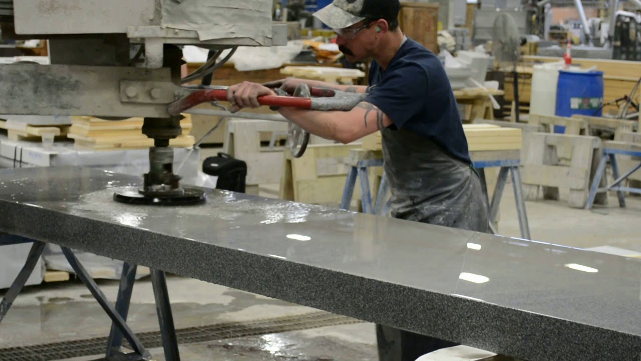 Rock of Ages craftsman, Will Karnedy, operating a handlebar machine