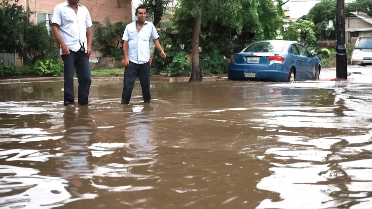 Drain Emergency Unclogging a Flash Flood Drain - YouTube