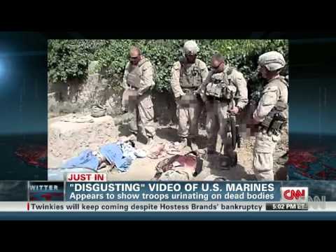 Washington (CNN) -- A number of websites including TMZ and YouTube posted a video Wednesday showing four men dressed in US Marine Corps combat gear urinating on the apparently Martyred bodies of three men sprawled on the ground in front of them. One of the men says, "Have a great day, buddy." A voice asks, "You got it on the video?" to which another voice responds, "Yeah." Another jokes, "Golden, like a shower." It was not clear who shot or posted the 39-second video, who the people pictured in it were, or where it was shot.