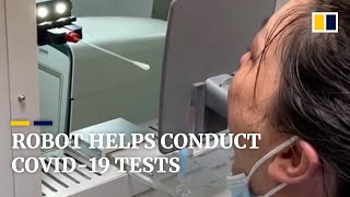 Robot helps conduct Covid-19 tests for people in China