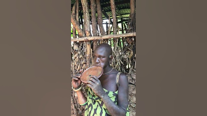 The lady from suri tribe inserting lip plate