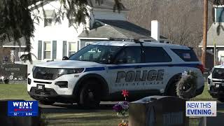 Laying wreaths on former Elmira Police Department officers' graves