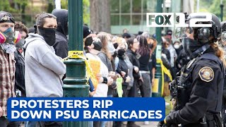 Protesters rip down barricades outside PSU library after police leave