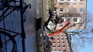 A car being fished out of the Kattenslot canal in Amsterdam (uncut horizontal)