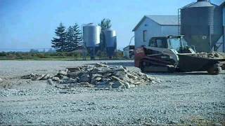 Loading a Bobcat dumping hopper, the ADD version.