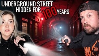 Underground Victorian Steet Uncovered After 100 years | RIDDLED IN PARANORMAL ENERGY
#abandoned #haunted #exploringwithfighters
History of The Royal Arcade
1899 - 1987
In March 1899, five months before the last phase of the land purchase was finished, Tuner & Fowlds applied to the local authority for permission to build a covered shopping arcade. While the older buildings on the site would be retained the other buildings would be demolished to make way for the new arcade.
The fundamental element of the plan was to provide the maximum number of shops with shop windows fronting onto publicly accessible roads or walkways. The proposed covered arcade formed a T plan with its entrance on Low Street. The east - west axis of the Turner & Fowlds site ran from Fleece Street to intercept the cross bar of the arcade. To avoid confusion the north - south section of the arcade will now be referred to as the Low Street Arcade and the east - west section as the Fleece Street Arcade.
Within the roughly rectangular plot of land, it was proposed to build 12 shops back-to-back with 6 units having windows into Low Street and 6 with windows onto the Fleece Street Arcade. On both ends of this block there were further units fronting onto Fleece Street and the Low Street Arcade. On the west side of the Low Street Arcade there were to be a further five shops fronting onto the arcade. Two further shops were added at the north end of Fleece Street.
The most distinctive feature of the Royal Arcade was located at the north end of the Low Street Arcade where the covered walkway terminated in a single large, covered area that occupied the yard space of the earlier buildings with a suspended gallery projecting from the north, east and west. The arcade was to be built within a plot of land bounded by Low Street, the proposed Low Street Arcade, Fleece Street Arcade.
As the full depth of the shops at ground level was given over to retail sales, merchandise storage had to be provided elsewhere. For the largest shops, the solution was to provide cellar space accessed by individual flights of steps from the shops above. Below the smaller shops the space was undivided and accessible only from a door and steps in the Low Street Arcade. It is probable that this portion of the cellar was communal and may also have been available to the south range of shops in the Fleece Street Arcade which appear to have been single room lock ups only. Further access to the storage cellar units was by corridors that lay below the arcade walkways.
The application was approved with some minor amendments and complex of shops, arcade and living accommodation above was completed by 1901 and formerly known as the Royal Arcade and Crown Buildings.
Nothing has emerged in documentation to show how successful the Royal Arcade was in returning Turner and Fowlds investment, but it didnt stay in joint ownership for long. Tuner died in 1915; at that time the Royal Arcade was owned jointly with Hiram Faulds but by 1919 it was in the sole ownership of Tuners sons Ernest and Wilfrid. As soon as they had taken control of the site, the Turner brothers began a piecemeal disposal of the property. By 1933 a large proportion of the arcade was owned by Frank Butterfield.
Butterfield had been a partner in Gott & Butterfields iron mongers who had been tenants at the arcade since at least 1919. Their shop was once described as an Aladdins cave selling household goods, bicycles and camping equipment and the whole arcade was popularly known as Butterfields Arcade.
1999 - Present Day
History of The Royal Arcade
1999 - Present Day
In 1999 it was acquired by Kingfisher Developments and proposed to renovate the Grade 2 listed building to its former Edwardian splendour.
During the early stages of this renovation a clearance programme was undertaken including the cellars which by that time were almost completely full of rubbish. It was at that time that the true nature of the cellars was discovered for the first time.
Once the cellars had been partially cleared it became apparent that there was a complete lower-level arcade of shops below the ground along both sides of an underground street. Some of the shops still have their glass windows intact, together with front doors, letterboxes and door numbers.
A number of enamel advertising signs were found indicating that the shops were probably used from an early date, perhaps even from the opening of the Royal Arcade and Crown Buildings in 1901.
Originally most of the cellars had wooden stairs up to the shops above; most of these have now gone although there is still access from one or two of the shops. The arcade was lit by pavement lights set into the pedestrian walkways and streets but these have all now been covered over and the cellars are in darkness.
Once the restoration of the arcade had been completed it was officially reopened as by Keighley historian Ian Dewhirst on the 27th of June 2003. The Royal Arcade now consists of 14 shops on the ground floor and 23 flats on the upper floors. Underground Victorian Steet Uncovered After 100 years | RIDDLED IN PARANORMAL ENERGY
