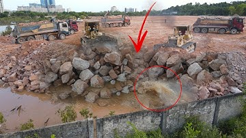 Nice Team Work Filling Rock Deep into the Ground by Operator  Bulldozer, Dump Truck Moving Stone