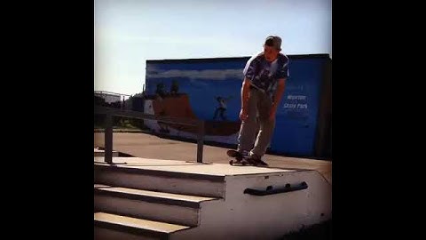 Backside boardslide down handrail