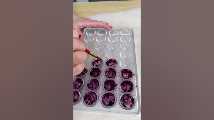 Painting bonbon moulds for chocolate