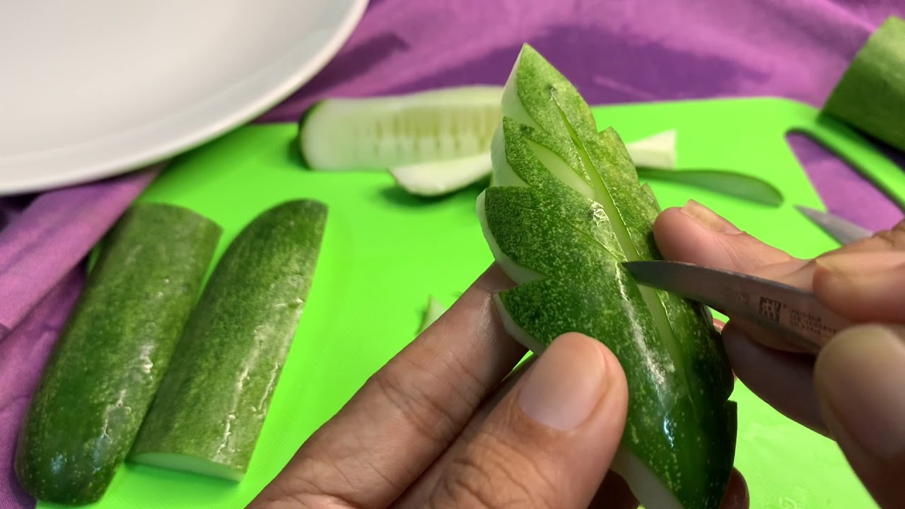 Carve cucumbers into simple leaves and flowers
