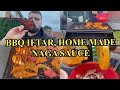 Naga chops on a bbq for iftar and tandoori chicken wings home made naga sauce