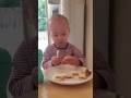Caleb eating almond butter and jelly sandwich