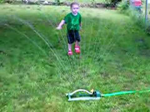 Trent in the sprinkler