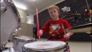 Iron Man 10 year old drumming. Starts at 3:35
